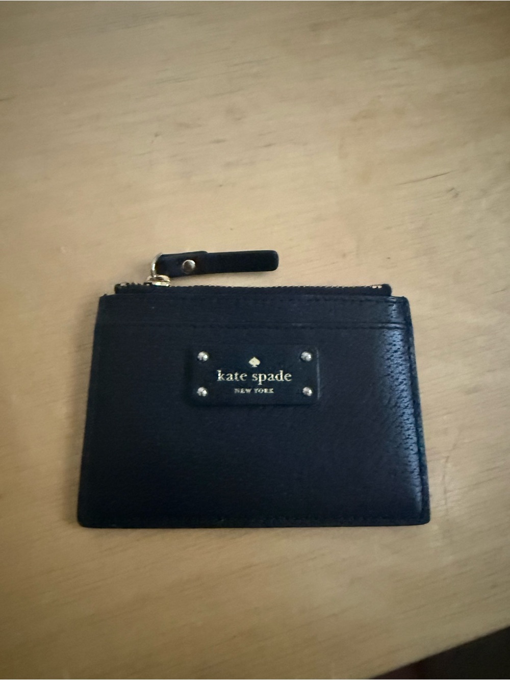 kate spade black leather zip card case with gold-tone plaque